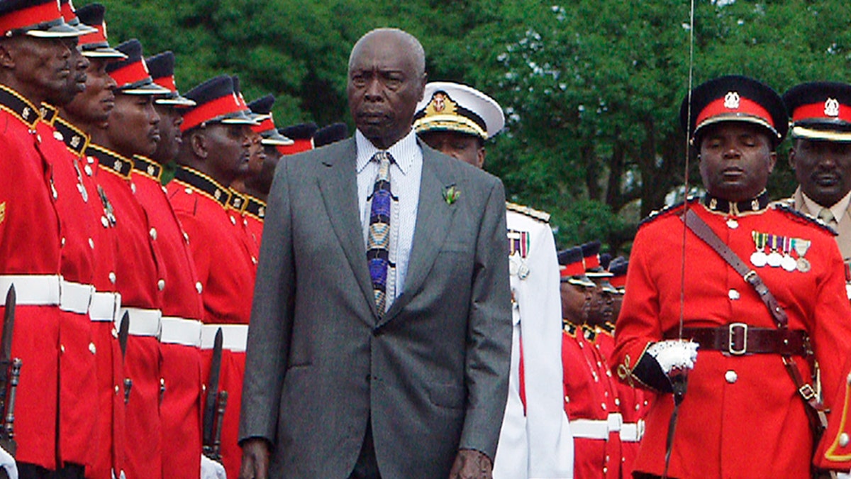 Kenya President Daniel arap Moi inspects a guard of honor at a barracks in Nairobi, Kenya during a 2002 parade by the armed forces in honor of the leader.