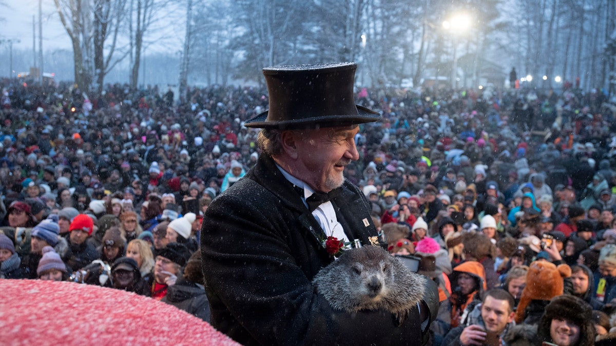 Groundhog Club co-handler John Griffiths holds Punxsutawney Phil during the 134th celebration of Groundhog Day on Gobbler's Knob in Punxsutawney, Pa.