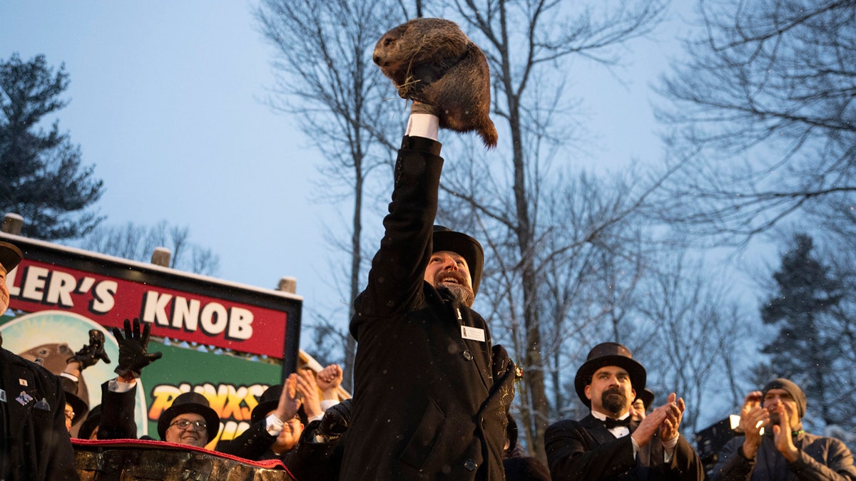 Groundhog Club co-handler Al Dereume holds Punxsutawney Phil, the weather prognosticating groundhog, during the 134th celebration of Groundhog Day on Gobbler's Knob in Punxsutawney, Pa. Sunday, Feb. 2, 2020.