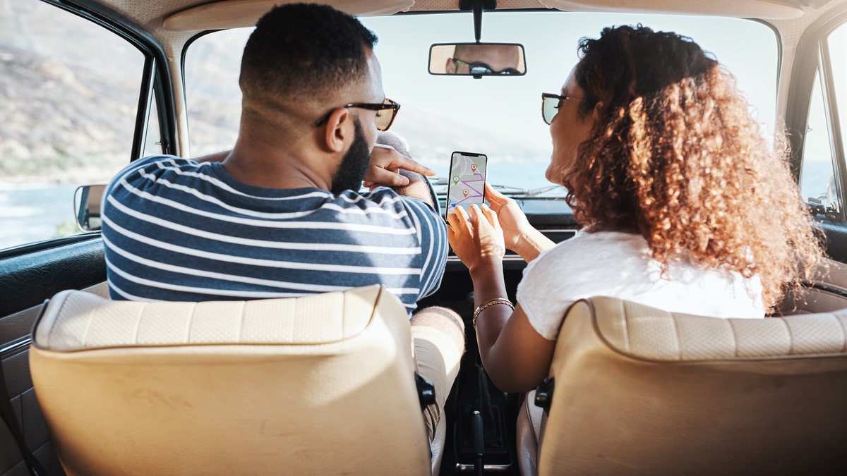 Couple using GPS on their phones