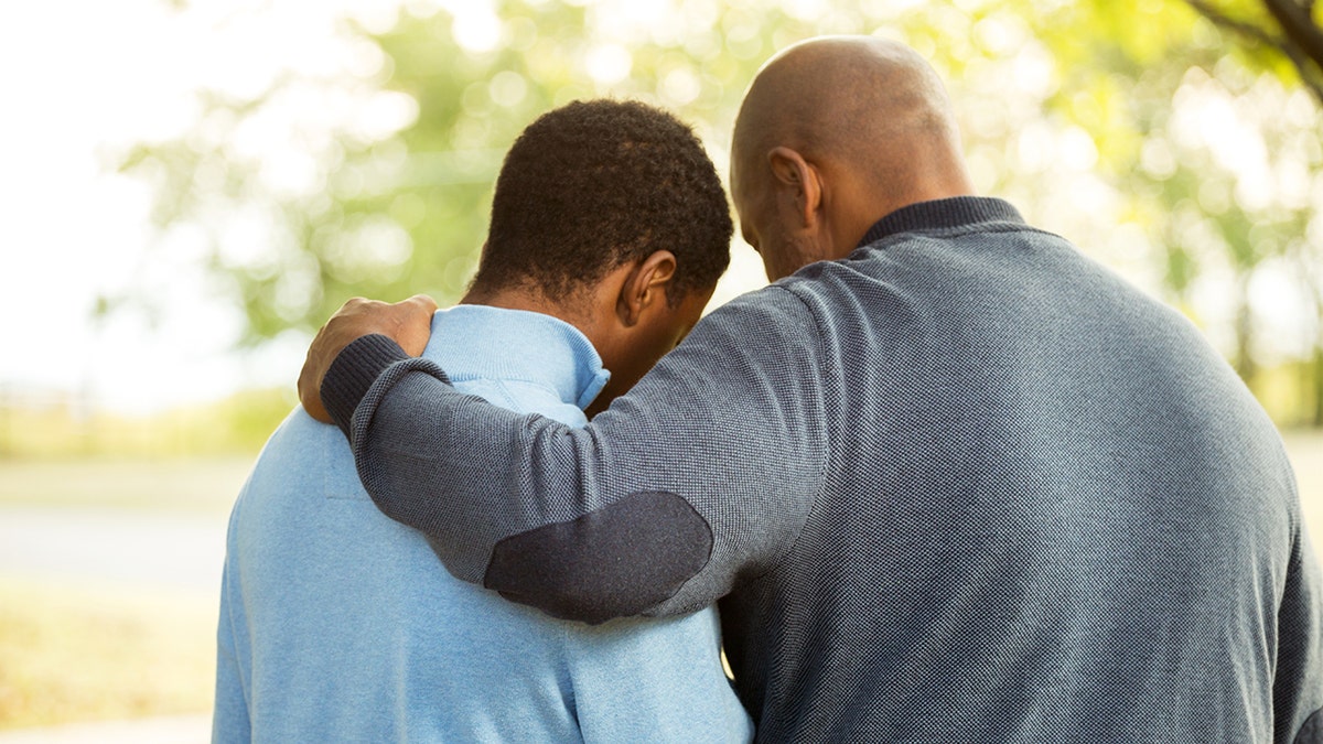 Father talking with his son