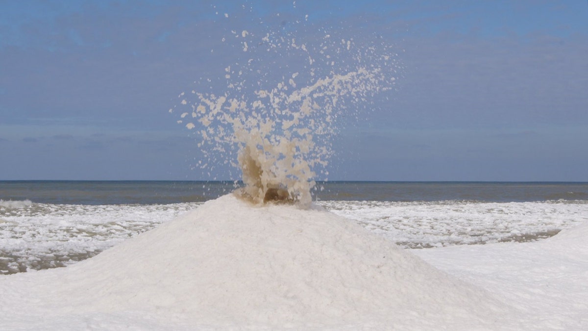 "Ice volcanoes" tend to occur on locations on the shoreline where waves strike with force.