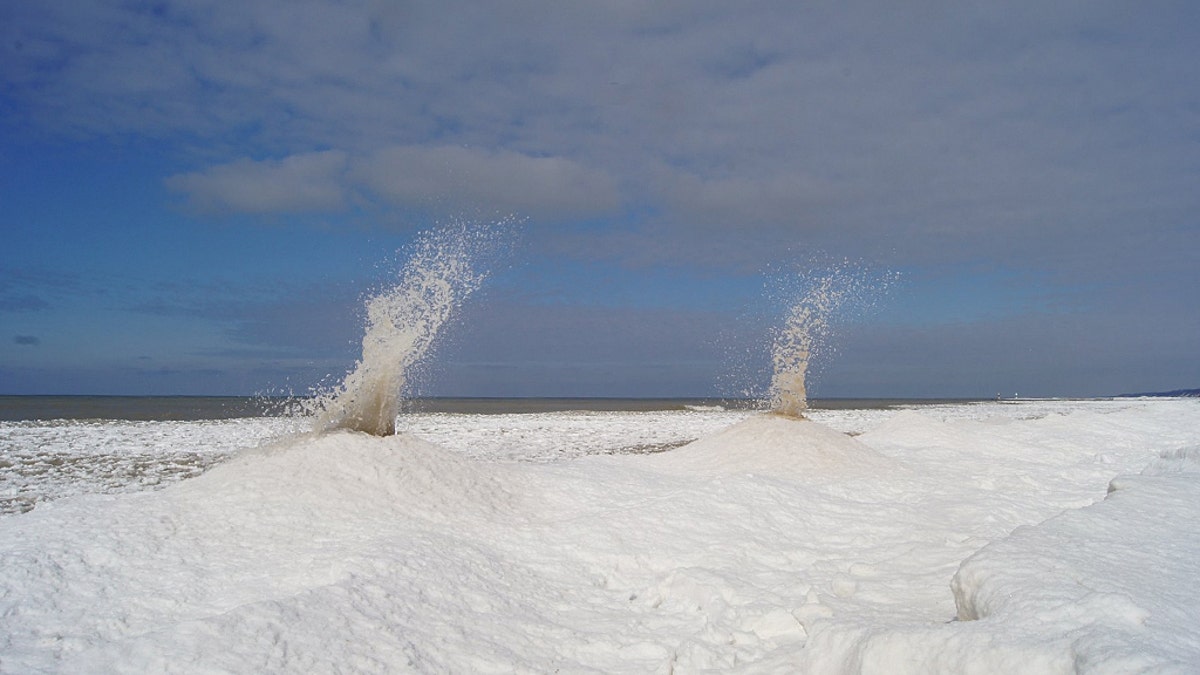"Ice volcanoes" can be seen erupted on Sunday along the shore of Lake Michigan.