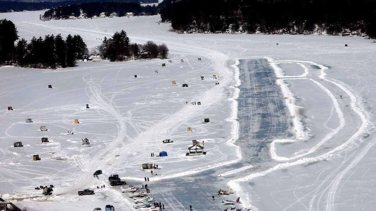 In this Feb. 28, 2015, file photo, planes are parked after landing on a frozen Lake Winnipesaukee in Alton, N.H.
