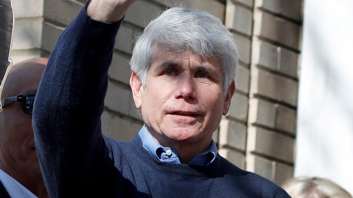 Former Illinois Gov. Rod Blagojevich and his wife Patti wave to supporters after a news conference outside his home Wednesday, Feb. 19, 2020, in Chicago. On Tuesday, President Donald Trump commuted his 14-year prison sentence for political corruption. (AP Photo/Charles Rex Arbogast)
