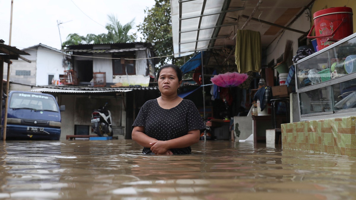 Overnight rains caused rivers to burst their banks in greater Jakarta sending muddy water into residential and commercial areas, inundating thousands of homes and paralyzing parts of the city's transport networks, officials said.