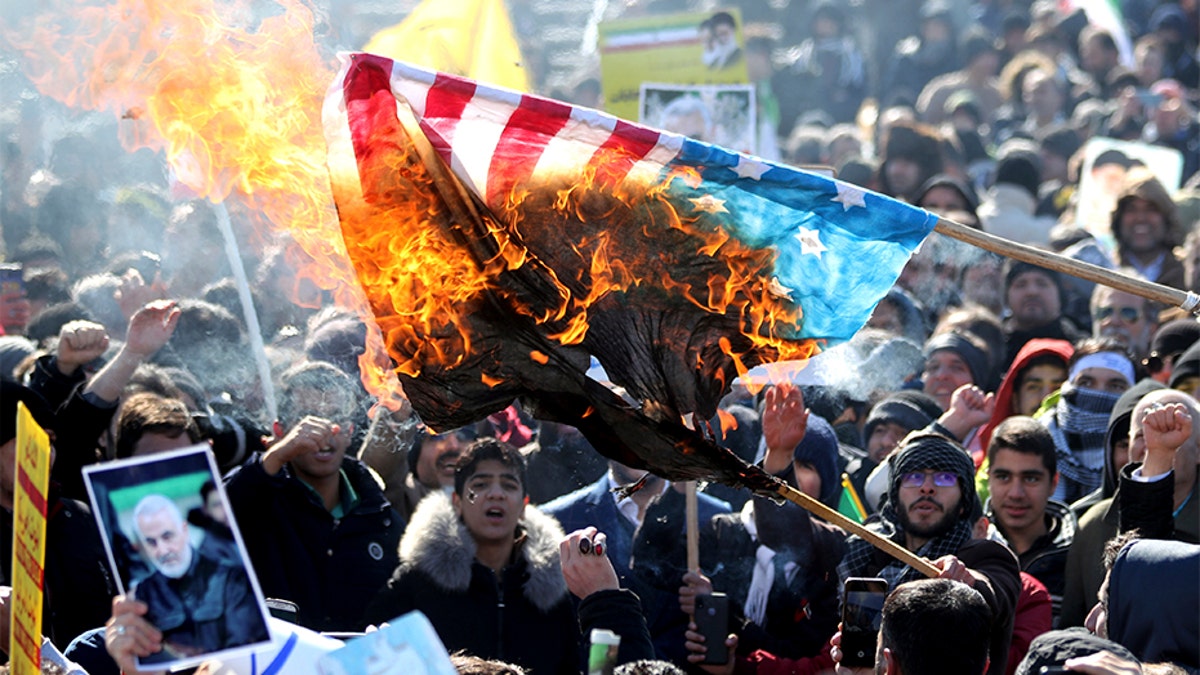 Iranian demonstrators burn a U.S. flag during a rally in Tehran on Tuesday celebrating the 41st anniversary of the Islamic Revolution.