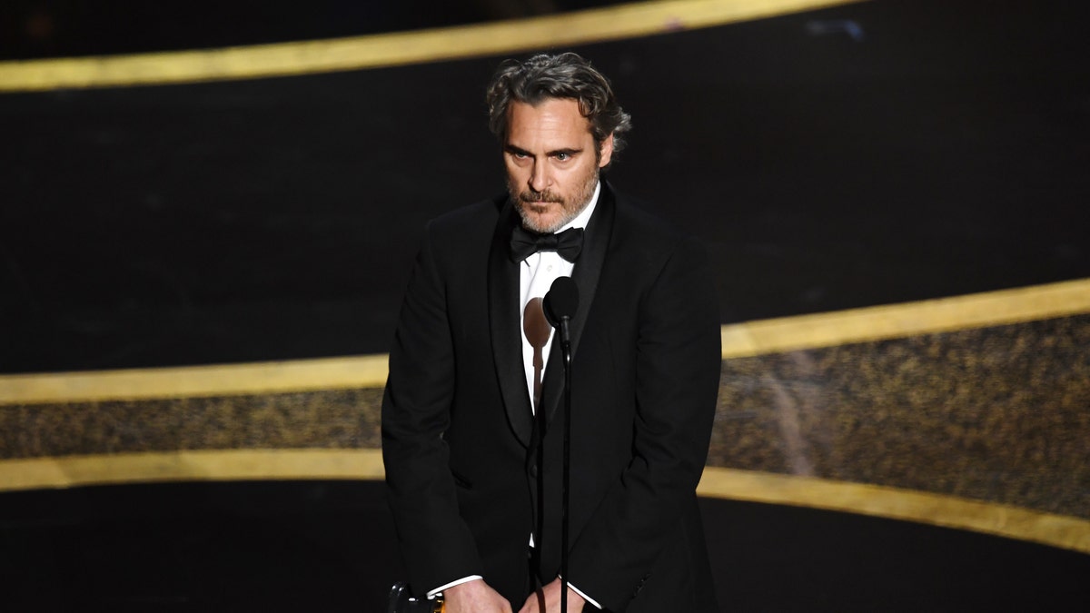 Joaquin Phoenix accepts the award for best actor in a leading role for 'Joker.'