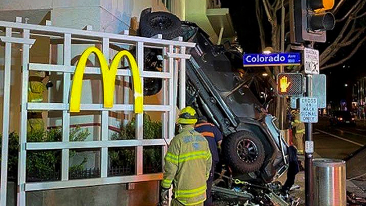 In this early Sunday, Feb. 23, 2020 photo released by the Santa Monica Fire Department shows a vehicle that plunged into the sidewalk in Santa Monica, Calif. (Santa Monica Fire Department via AP)