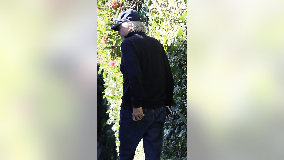 Micheal Douglas arrives at the home of Kirk Douglas's widow, Anne Buydens, in Beverly Hills just one day after announcing his father's death at age 103.