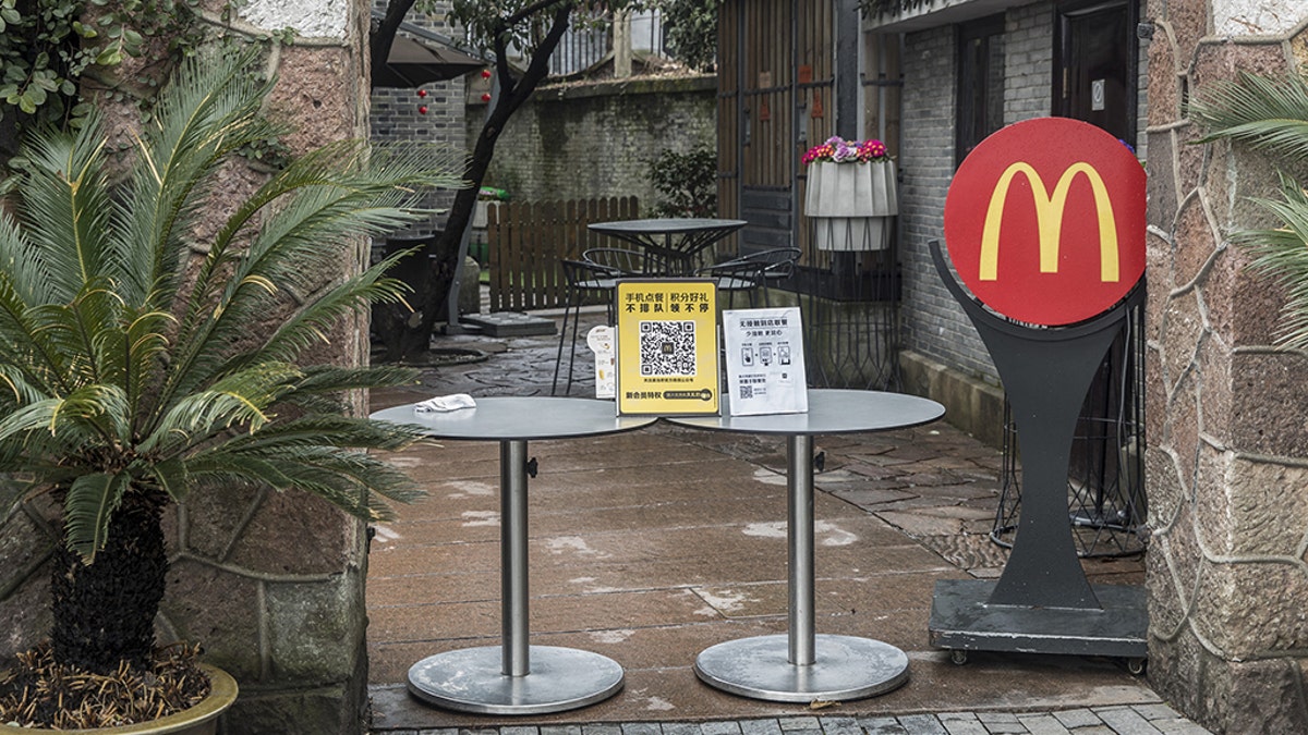 An entrance to a closed McDonald's Corp. restaurant is barricaded near the famous West Lake, usually a popular tourist attraction, in Hangzhou, China, on Tuesday, Feb. 11, 2020. The death toll from the coronavirus climbed above 1,000, as the Chinese province at the epicenter of the outbreak reported its highest number of fatalities yet. Photographer: Qilai Shen/Bloomberg via Getty Images