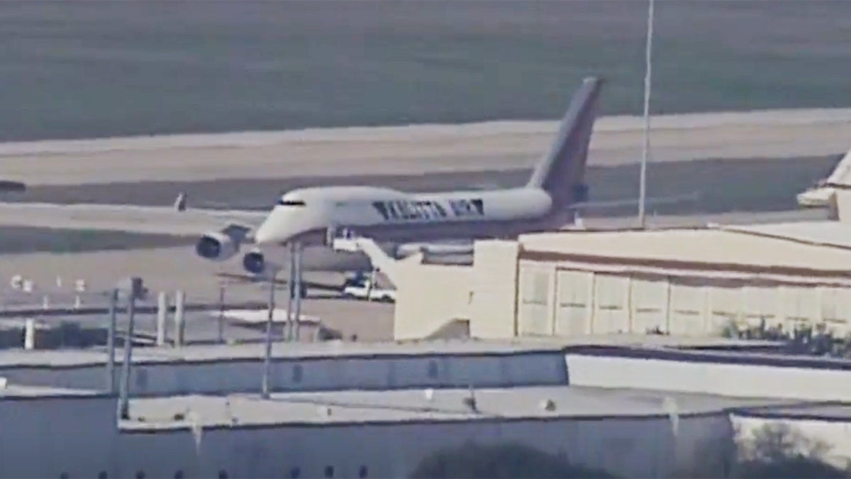 The plane arrived at Lackland Air Force Base in San Antonio just before 1:30 p.m. ET. Some passengers are expected to disembark at the base while others will continue on to Nebraska. 