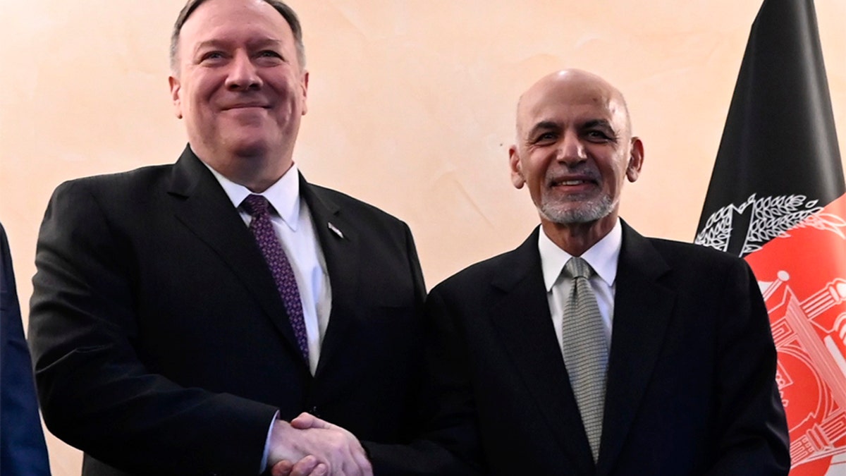 Afghanistan President Ashraf Ghani and US Secretary of State Mike Pomeo in black suits