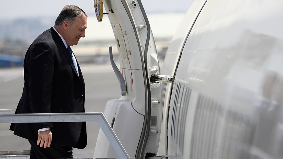 U.S. Secretary of State Mike Pompeo enters the plane before departing from the Addis Ababa Bole international Airport in Addis Ababa, Ethiopia, on Wednesday. (AP)