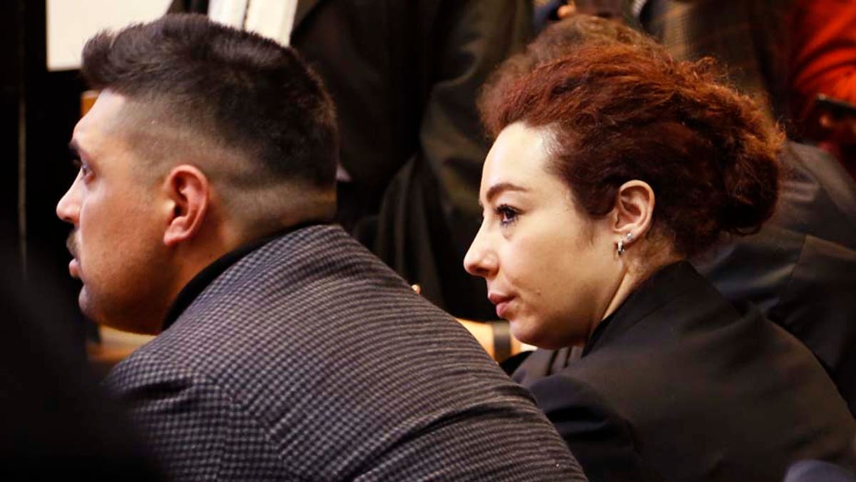 Maria Rosaria Cerciello Rega, wife of Mario Cerciello Rega, and Paolo Cerciello Rega, his brother, attend the opening of the trial for the killing of the Italian policeman Mario Cerciello Rega in Rome on Wednesday.