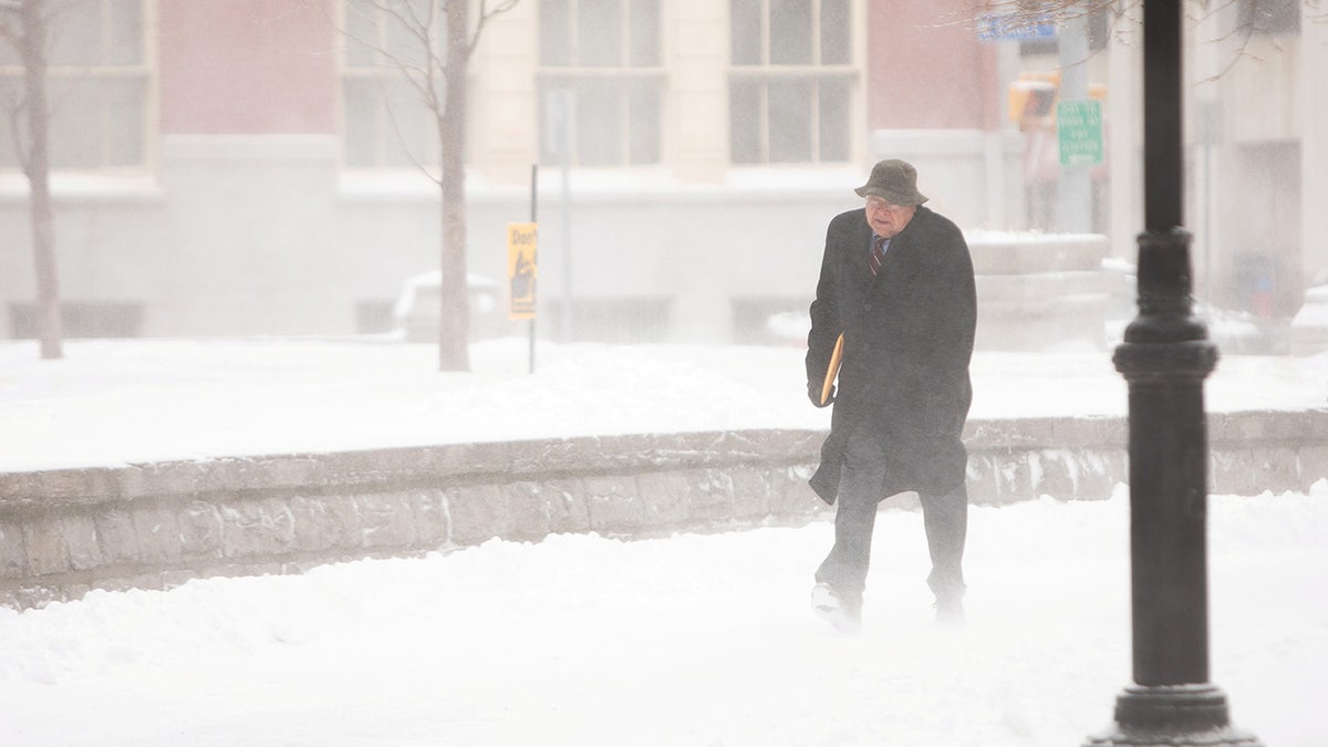 A man walks through blowing snow during blizzard in Buffalo, New York, U.S., Feb. 27. REUTERS/Lindsay DeDario 