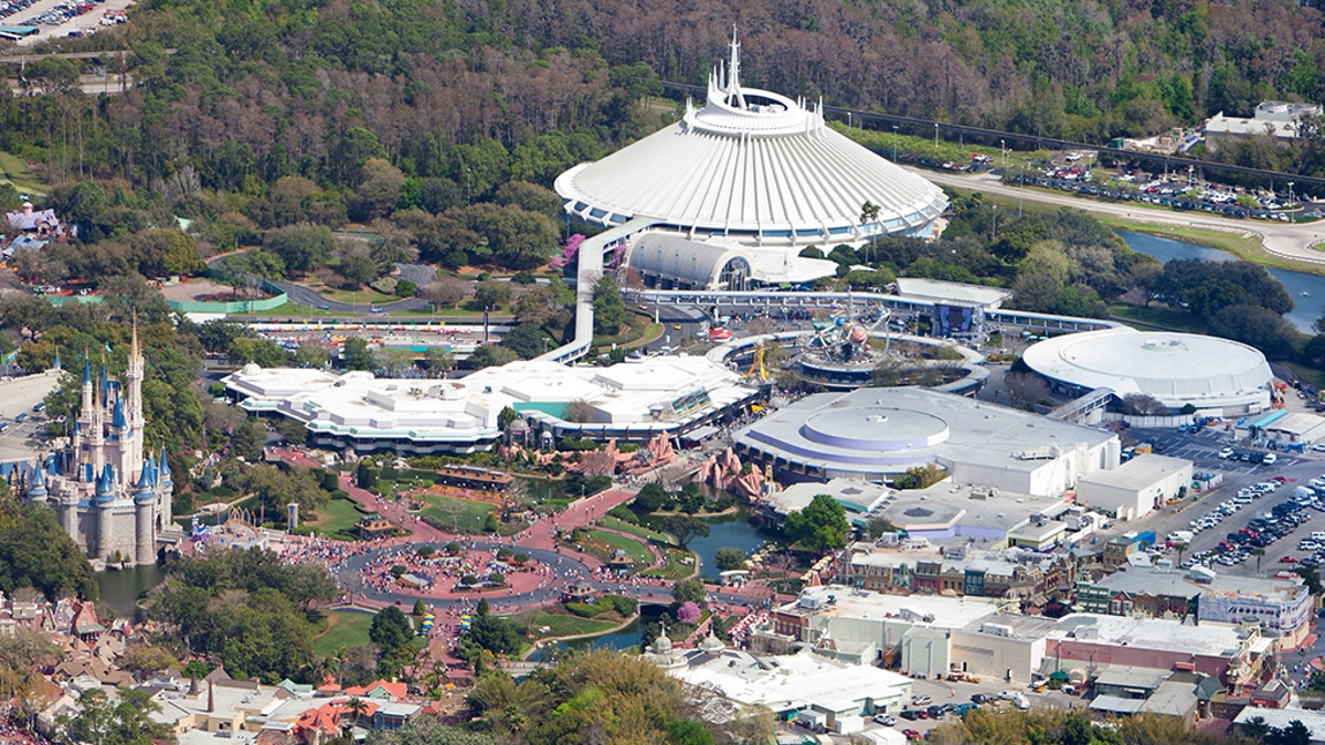 Aerial view of Walt Disney World with Cinderella's castle (left), Space Mountain &amp; Tomorrowland (top-center), Main Street, U.S.A. (right-center) and Monorail System (right). 