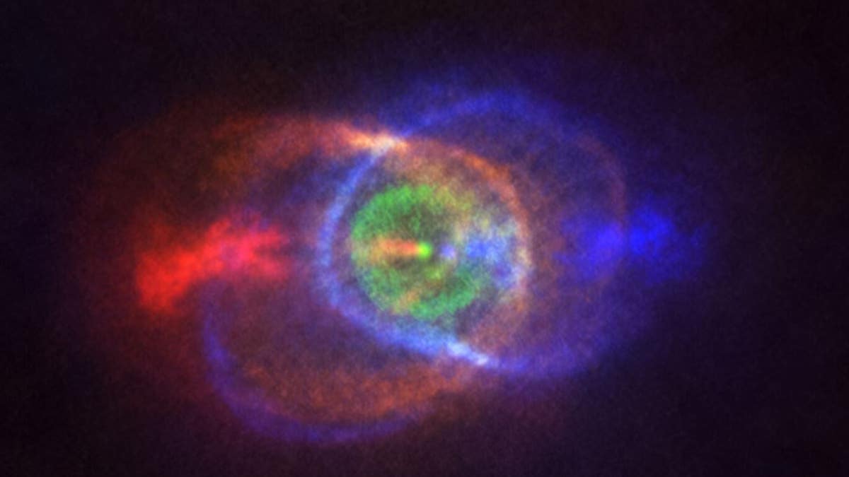 The Atacama Large Millimeter/submillimeter Array captured the bright blue and red clouds of gas surrounding the binary star system known as HD101584.