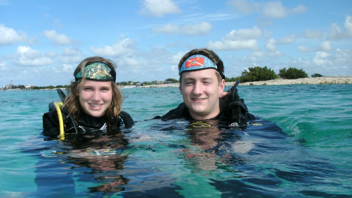 Scuba diving is a shared passion for Ethan Studenic and Morgan Whittaker, pictured, who got engaged while scuba diving in the Caribbean.
