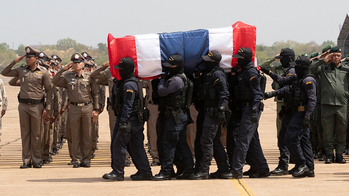 Members of the Thai special forces carry the coffin a fellow officer killed in a mass shooting, at a military airport in Nakhon Ratchasima, Thailand, on Monday. (AP)