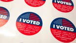 FILE - In this Tuesday, June 5, 2018, file photo, "I Voted" stickers wait for voters at a polling station inside the library at Robert F. Kennedy Elementary School in Los Angeles. California voters will be able to change their party affiliation and update their address at polling stations under a new law approved in time for the March 3 Democratic primary. The change was particularly sought as it will allow the state's 5.6 million independent voters to register with a party by filling out one form on election day. Democratic presidential campaigns hope the law will boost the number of registered Democrats and participation in their primary. (AP Photo/Richard Vogel, File)