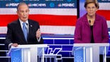 Democratic presidential candidates, former New York City Mayor Mike Bloomberg, left, speaks as Sen. Elizabeth Warren, D-Mass., looks on during a Democratic presidential primary debate Wednesday, Feb. 19, 2020, in Las Vegas, hosted by NBC News and MSNBC. (AP Photo/John Locher)