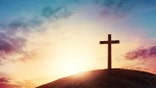 Silhouette cross on Calvary mountain sunset background. Easter concept