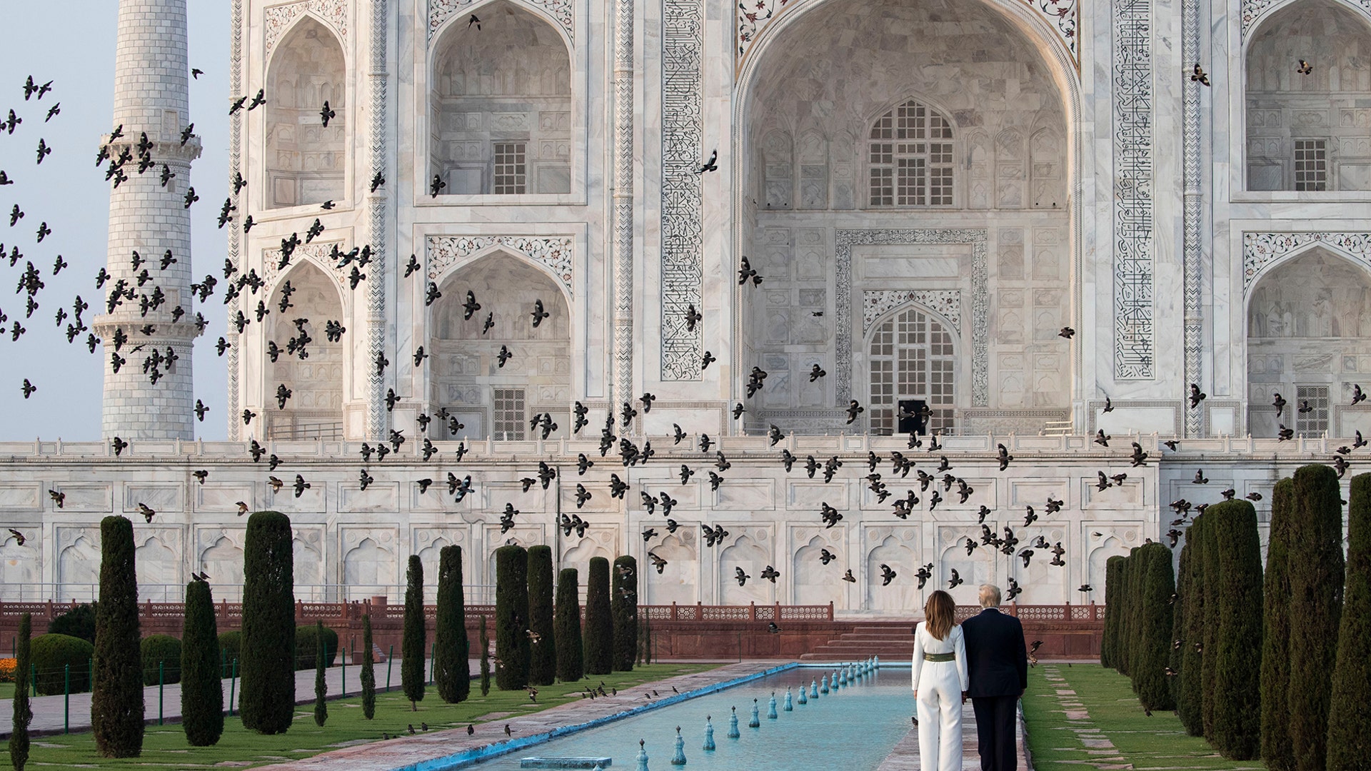 Birds fly past as President Donald Trump, with first lady Melania Trump, tour the Taj Mahal, in Agra, India, Feb. 24, 2020. 