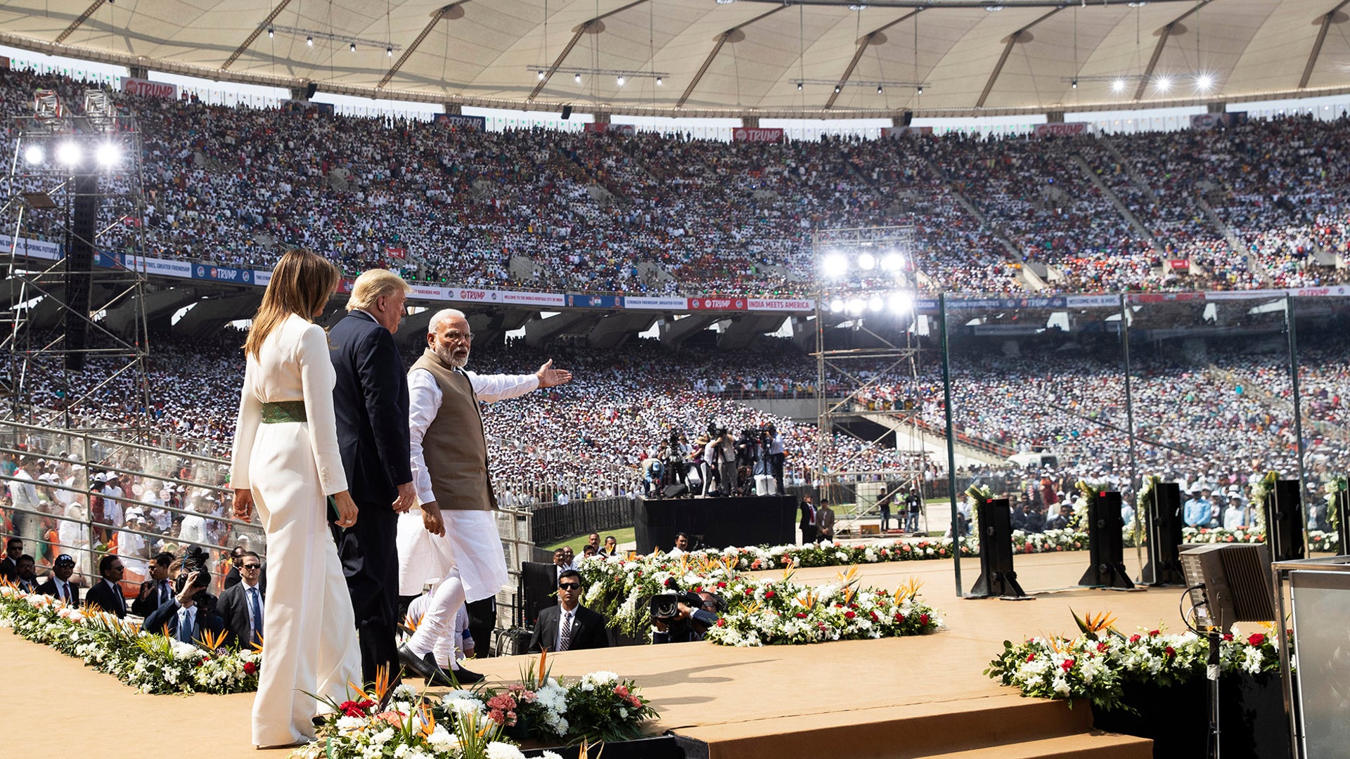 President Donald Trump, first lady Melania Trump, and Indian Prime Minister Narendra Modi arrive on stage at Sardar Patel Stadium in Ahmedabad, India.