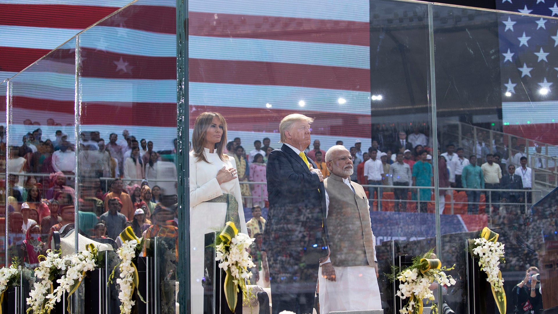 President Donald Trump, first lady Melania Trump, and Indian Prime Minister Narendra Modi stand during the national anthem at Sardar Patel Gujarat Stadium in Ahmedabad, India. 