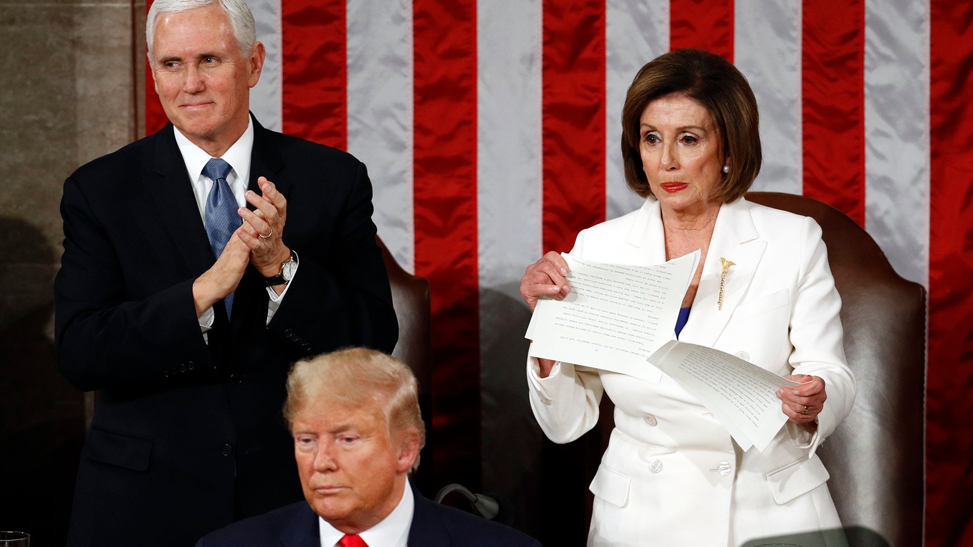 House Speaker Nancy Pelosi tears her copy of President Trump's s State of the Union address after he delivered it to a joint session of Congress on Capitol Hill in Washington, D.C., Feb. 4, 2020.