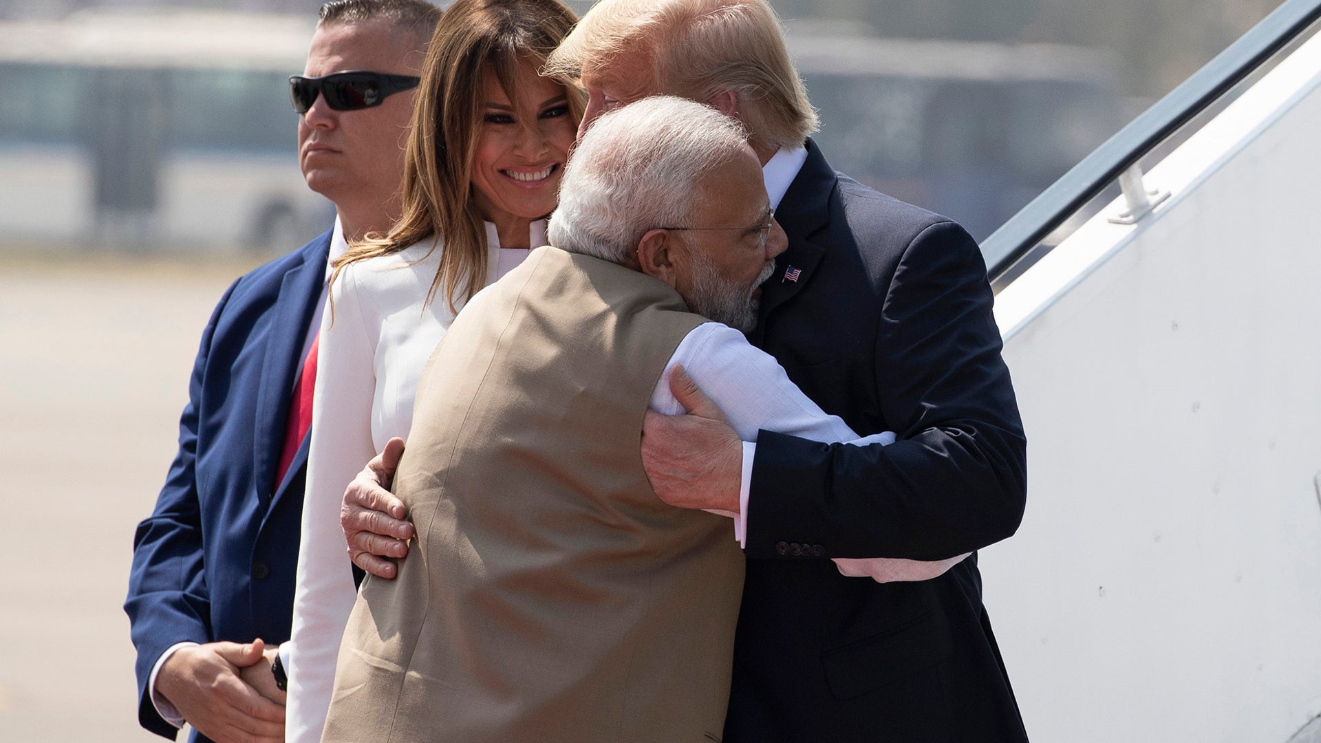 President Trump is greeted by Indian Prime Minister Narendra Modi, with first lady Melania Trump, as they step off Air Force One upon arrival at Sardar Vallabhbhai Patel International Airport in Ahmedabad, India.