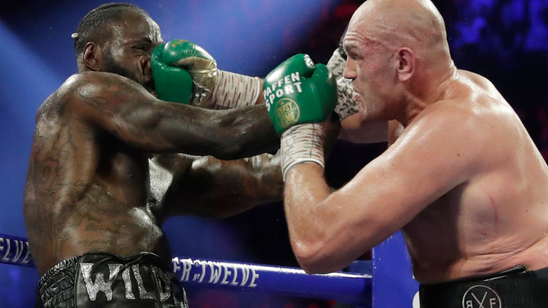 Tyson Fury, of England, lands a right to Deontay Wilder during a WBC heavyweight championship boxing match in Las Vegas, Feb. 22, 2020.