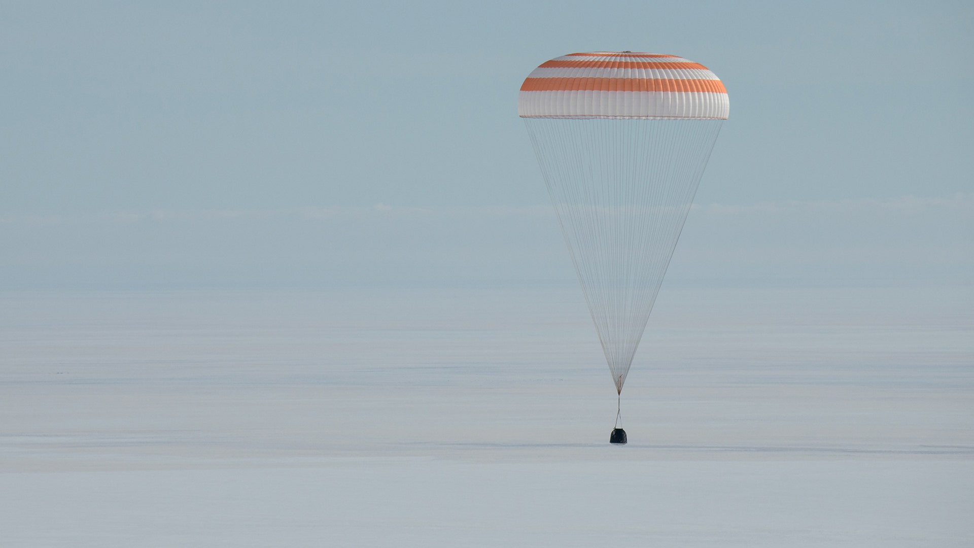 The Soyuz MS-13 spacecraft with Expedition 61 crew members Christina Koch of NASA, Alexander Skvortsov of the Russian space agency Roscosmos, and Luca Parmitano of ESA, lands in a remote area near the town of Zhezkazgan, Kazakhstan, Feb. 6, 2020.