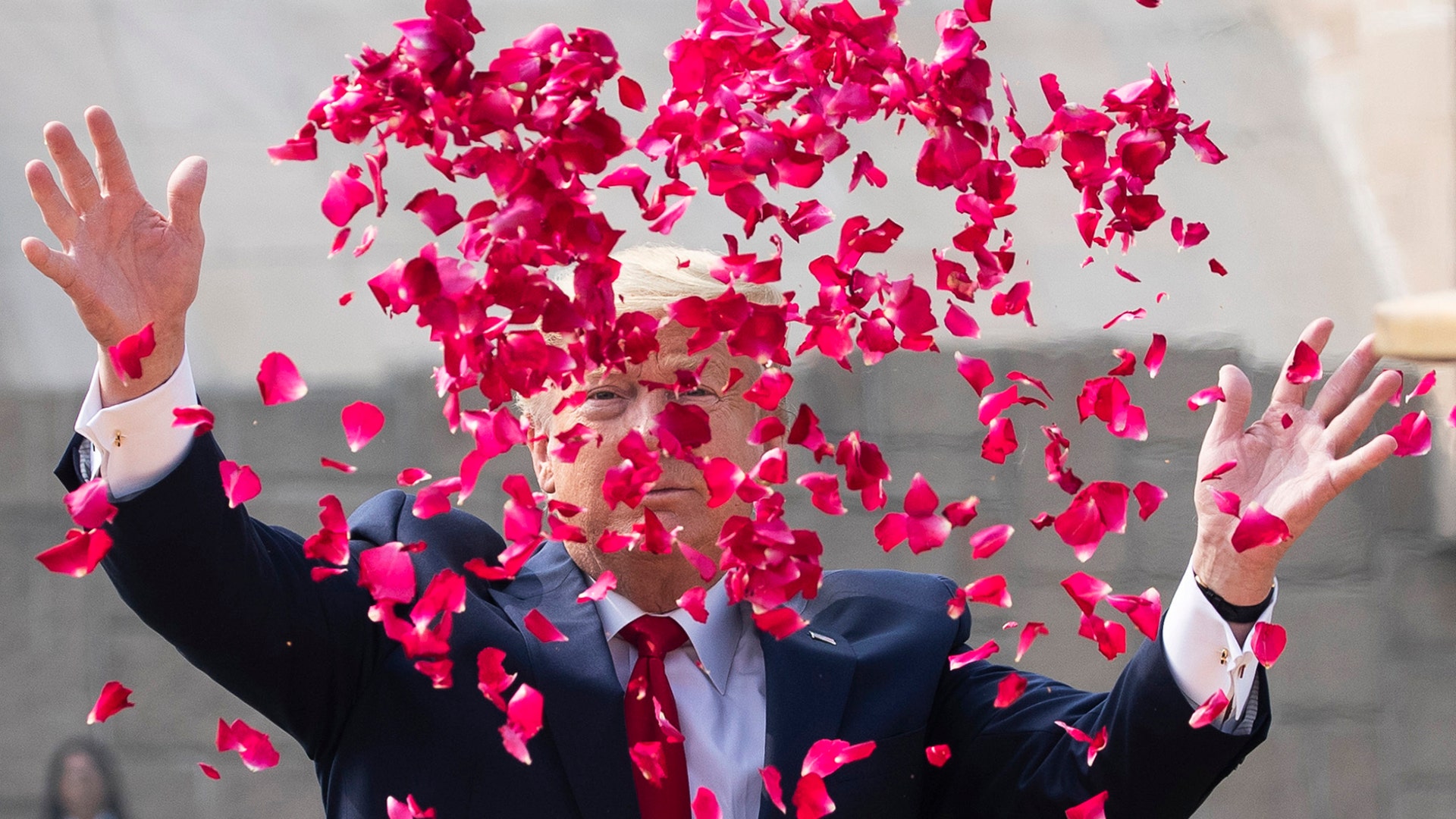 President Donald Trump offers floral respects at Raj Ghat, the memorial for Mahatma Gandhi, in New Delhi, India, Feb. 25, 2020. 
