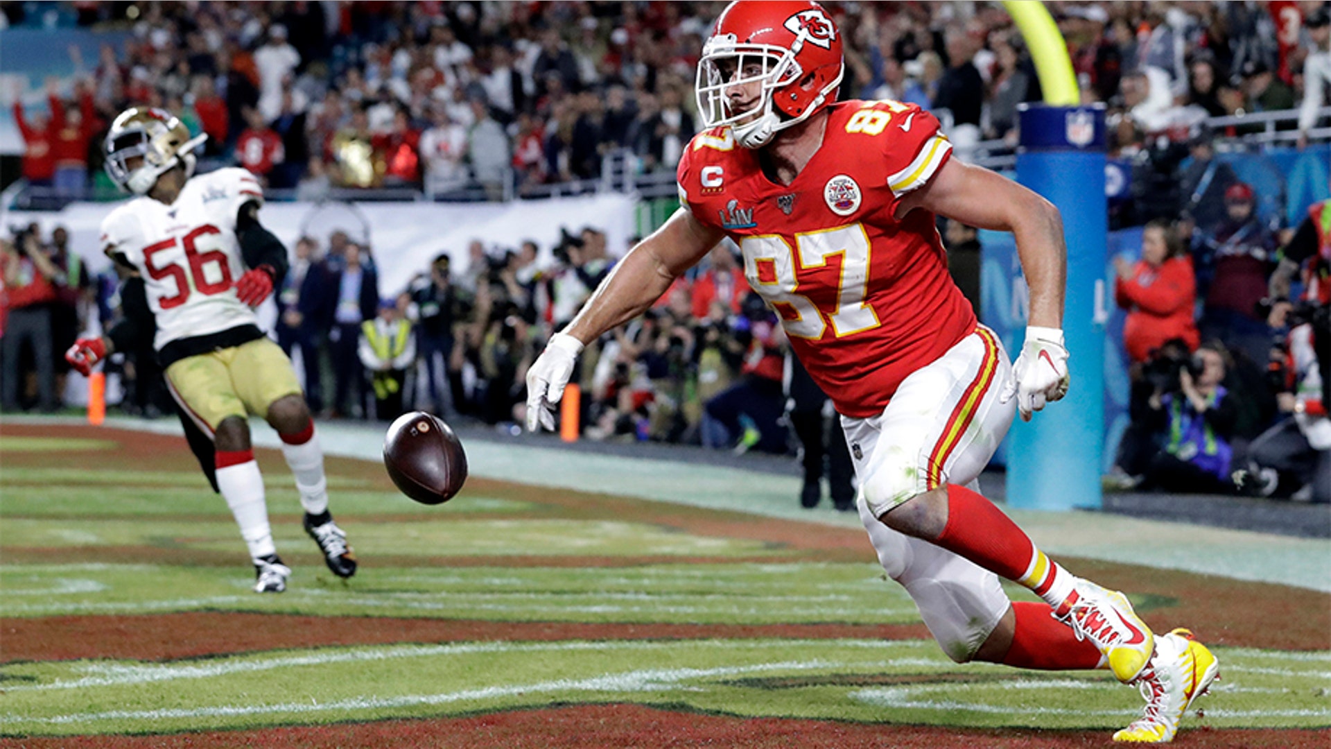Kansas City Chiefs' Travis Kelce (87) scores against the San Francisco 49ers during the second half.