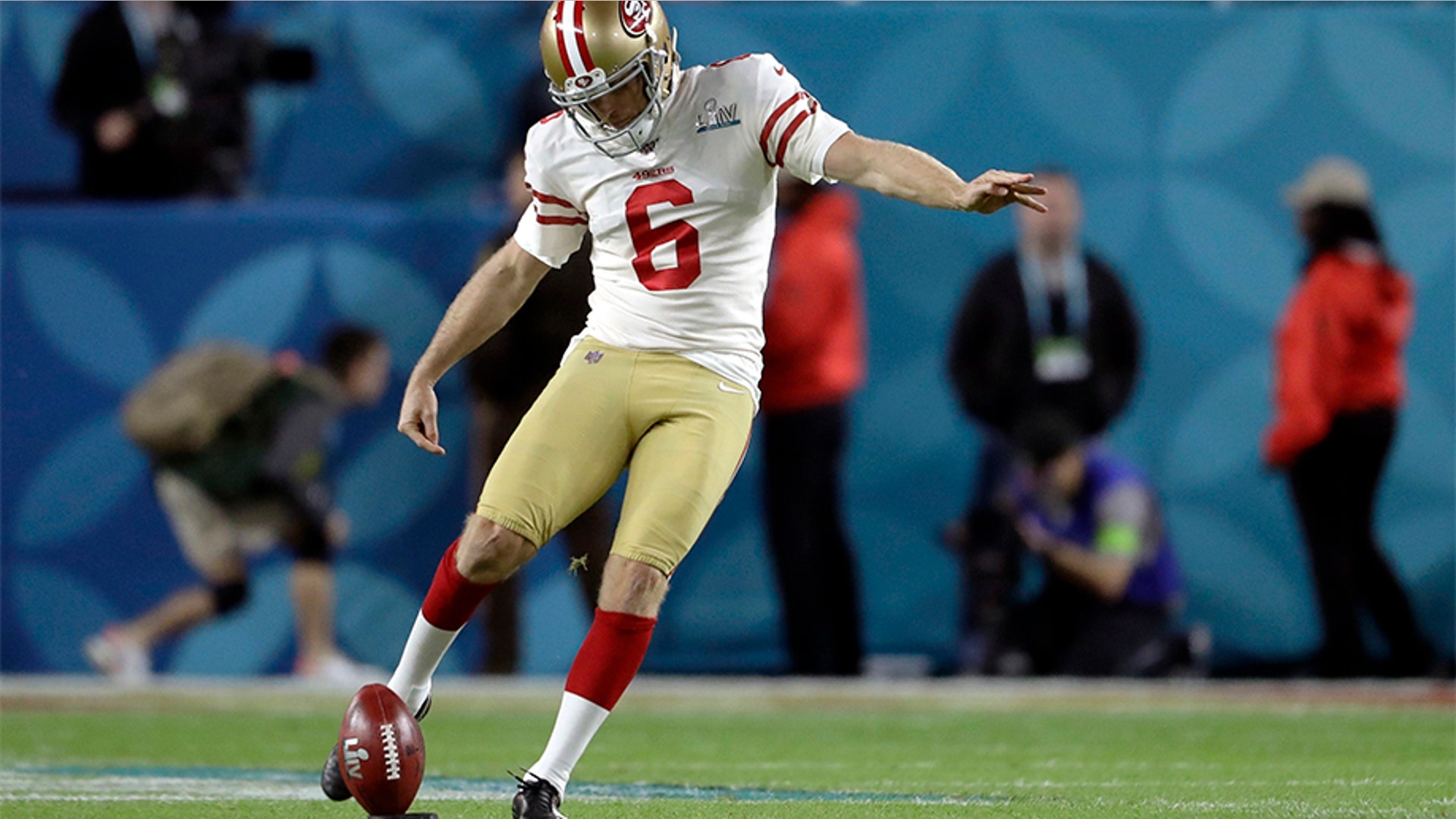 San Francisco 49ers' Mitch Wishnowsky kicks off against the Kansas City Chiefs to begin the NFL Super Bowl LIV football game in Miami Gardens, Fla.