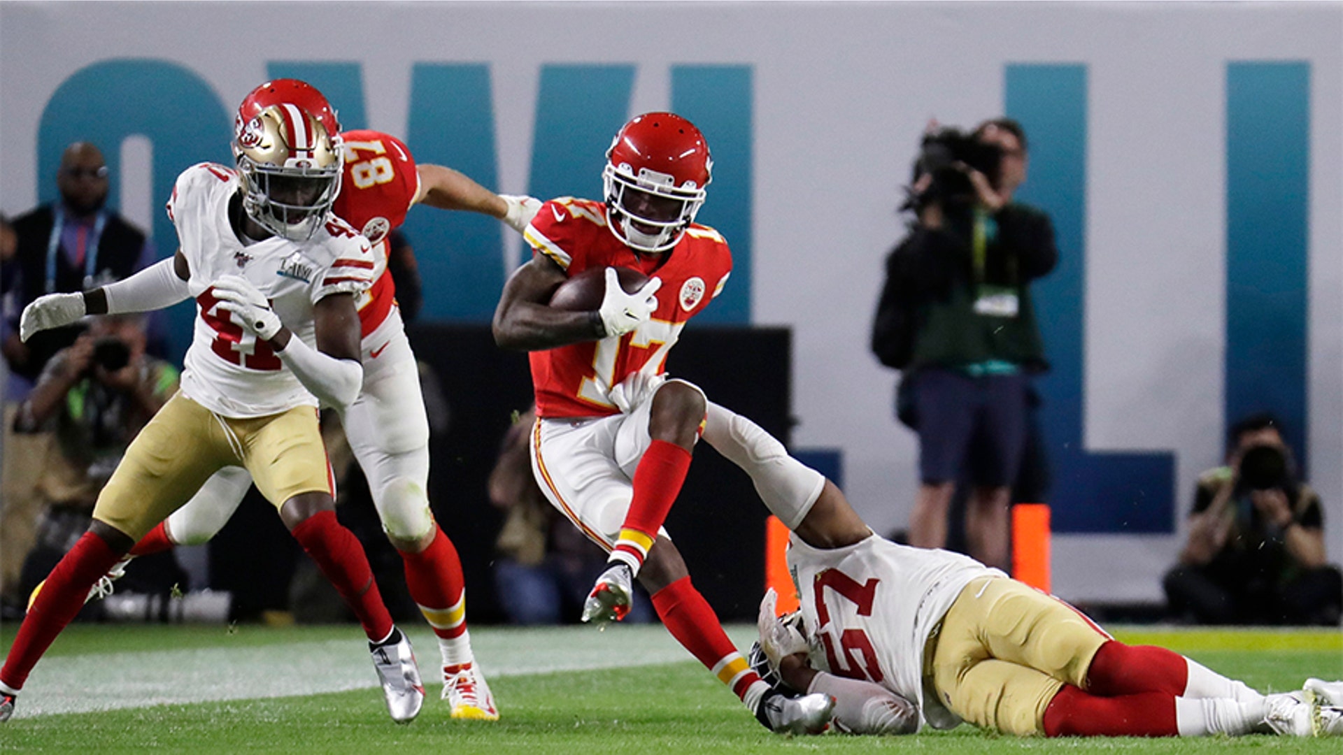 Kansas City Chiefs' Mecole Hardman (17) runs against the San Francisco 49ers during the first half.