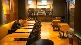 How has coronavirus affected China's and the world’s economy compared to SARS outbreak?