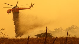 Australia wildfire containment efforts given a boost by heavy rain and flooding