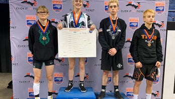 Female wrestler makes history, wins state high school championship