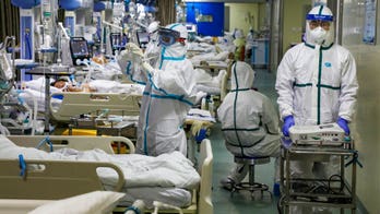 China sees record increase in daily coronavirus deaths; at least 908 dead in all