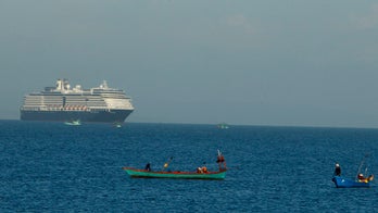 Cruise ship turned away over coronavirus docks in Cambodia