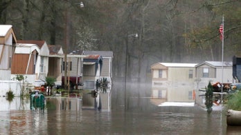 Flood-soaked Mississippi braces for additional rain as Alabama declares emergency