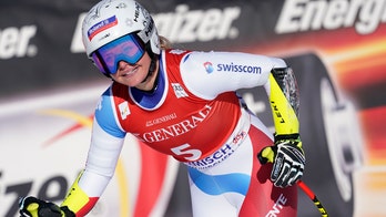 Suter wins 1st super-G, month after 1st downhill triumph