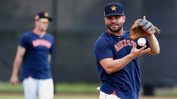 Houston Astros players heckled by fans during batting practice at spring training