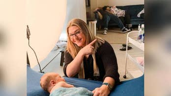 Photographer at Georgia newborn's photo shoot captures parents sleeping on couch
