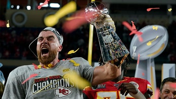 Kansas City Chiefs' Travis Kelce chugs beer off Lombardi Trophy, calls it 'Lombardi Luge'