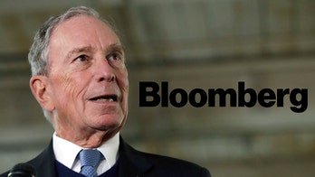 Bloomberg News ex-reporter's wife says his lawyers threatened to 'ruin' family over China reporting