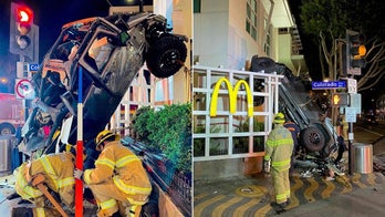 California man, 20, survives after driving car off top level of parking garage, police say